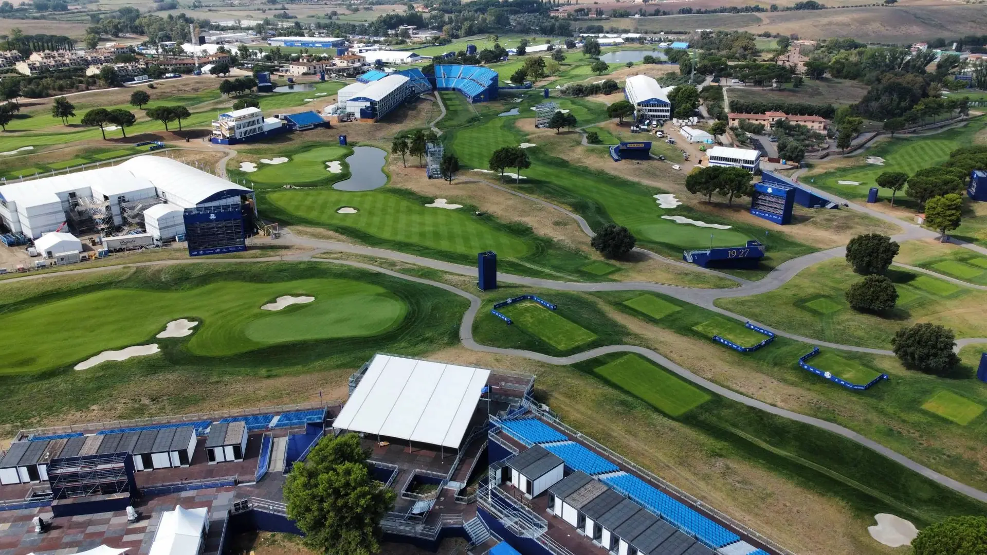 Aerial view of a championship golf course built out with grandstands, hospitality suites and broadcast compounds